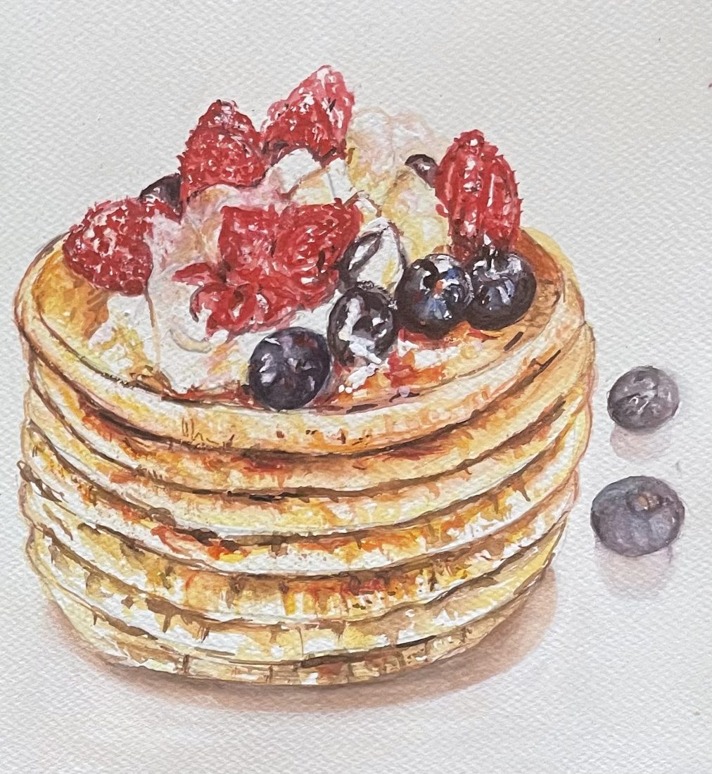 Watercolor of a tall stack of pancakes topped with berries and cream